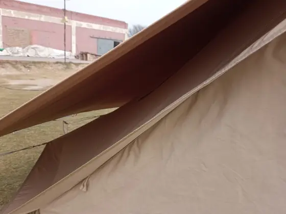 The fly sheet overhanging the canvas beneath it